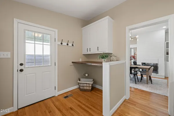 a view of kitchen with furniture and wooden floor