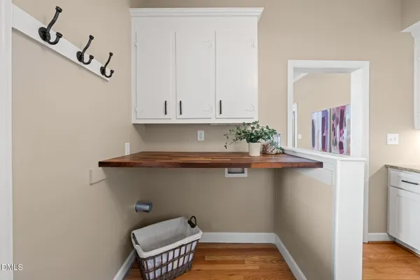 a view of kitchen with furniture and wooden floor