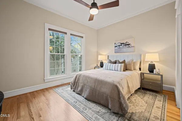 a bedroom with a large bed and a window