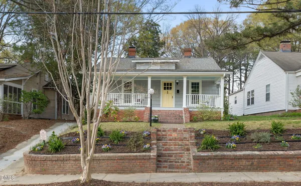 front view of a house with a garden