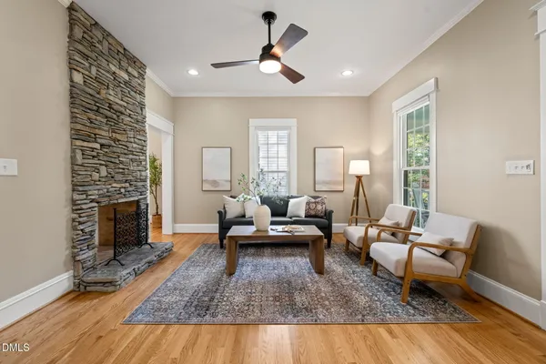 a living room with furniture and a fireplace