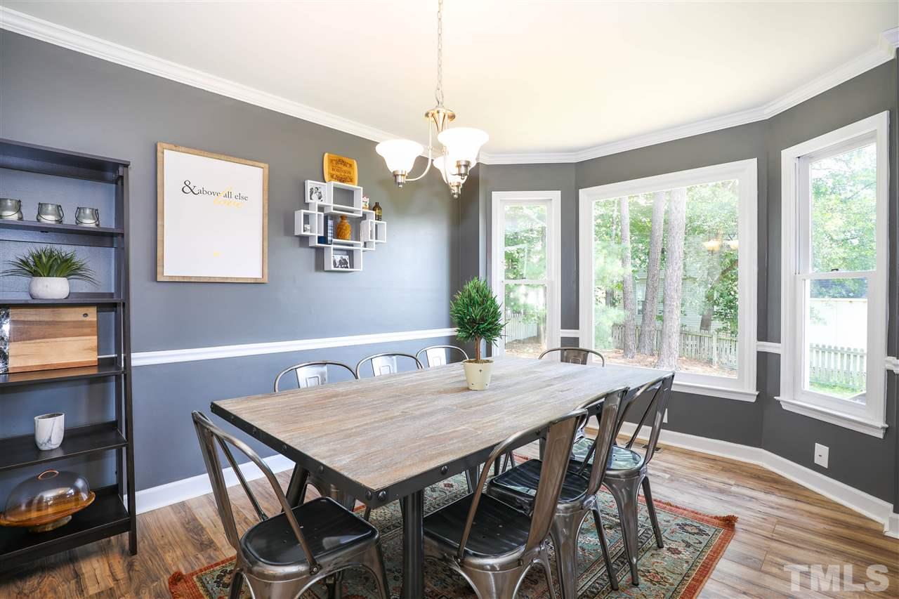 4841 Draper Road Raleigh, NC 27616 - Photo 14 of 30 a view of a dining room with furniture window and outside view