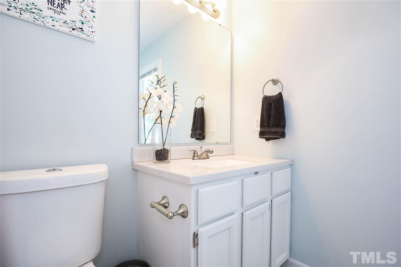 4841 Draper Road Raleigh, NC 27616 - Photo 18 of 30 a bathroom with a sink and a toilet