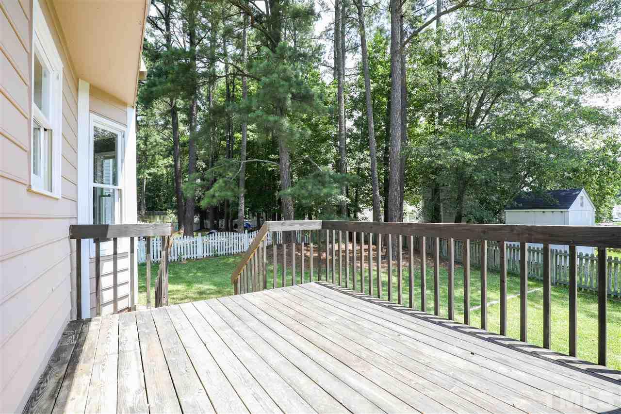 4841 Draper Road Raleigh, NC 27616 - Photo 24 of 30 a view of a wooden deck