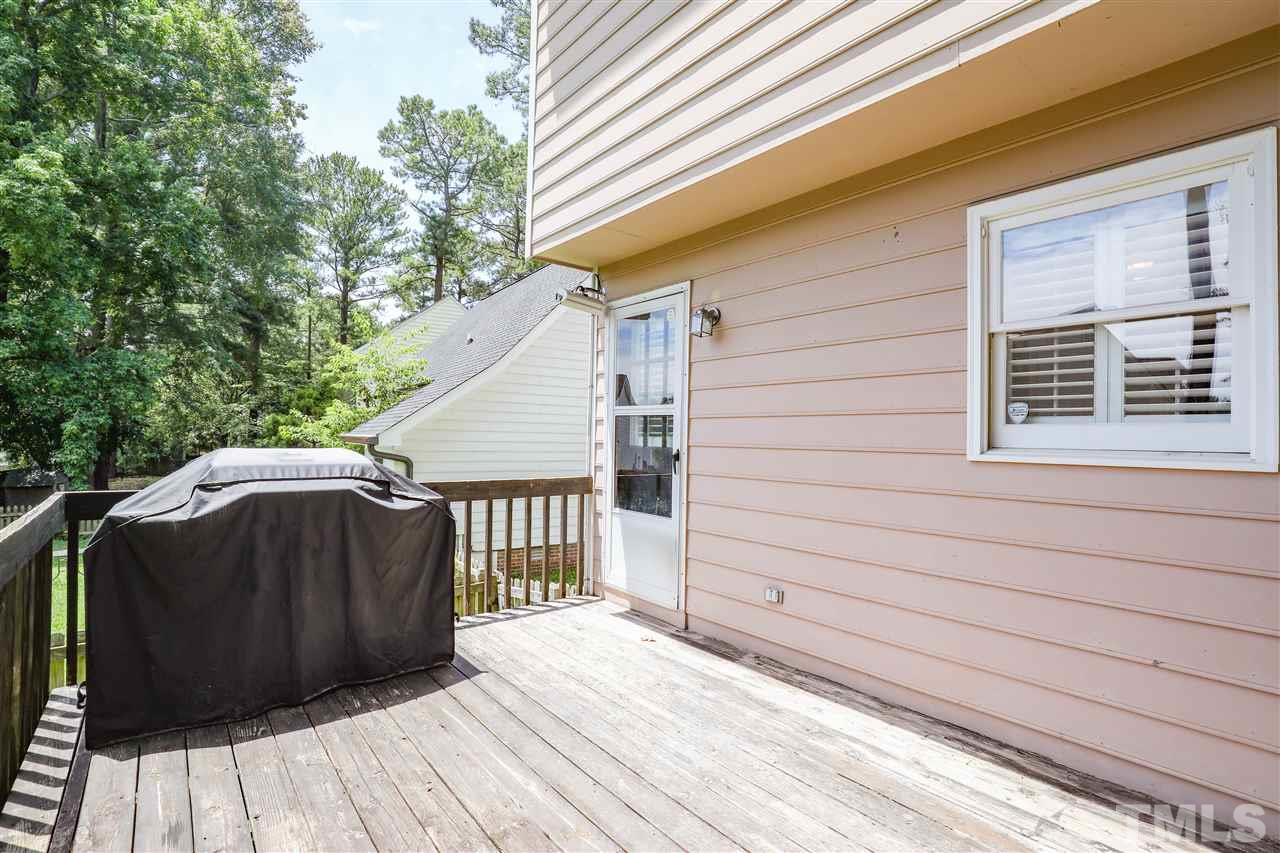 4841 Draper Road Raleigh, NC 27616 - Photo 25 of 30 a view of a wooden balcony with a sink