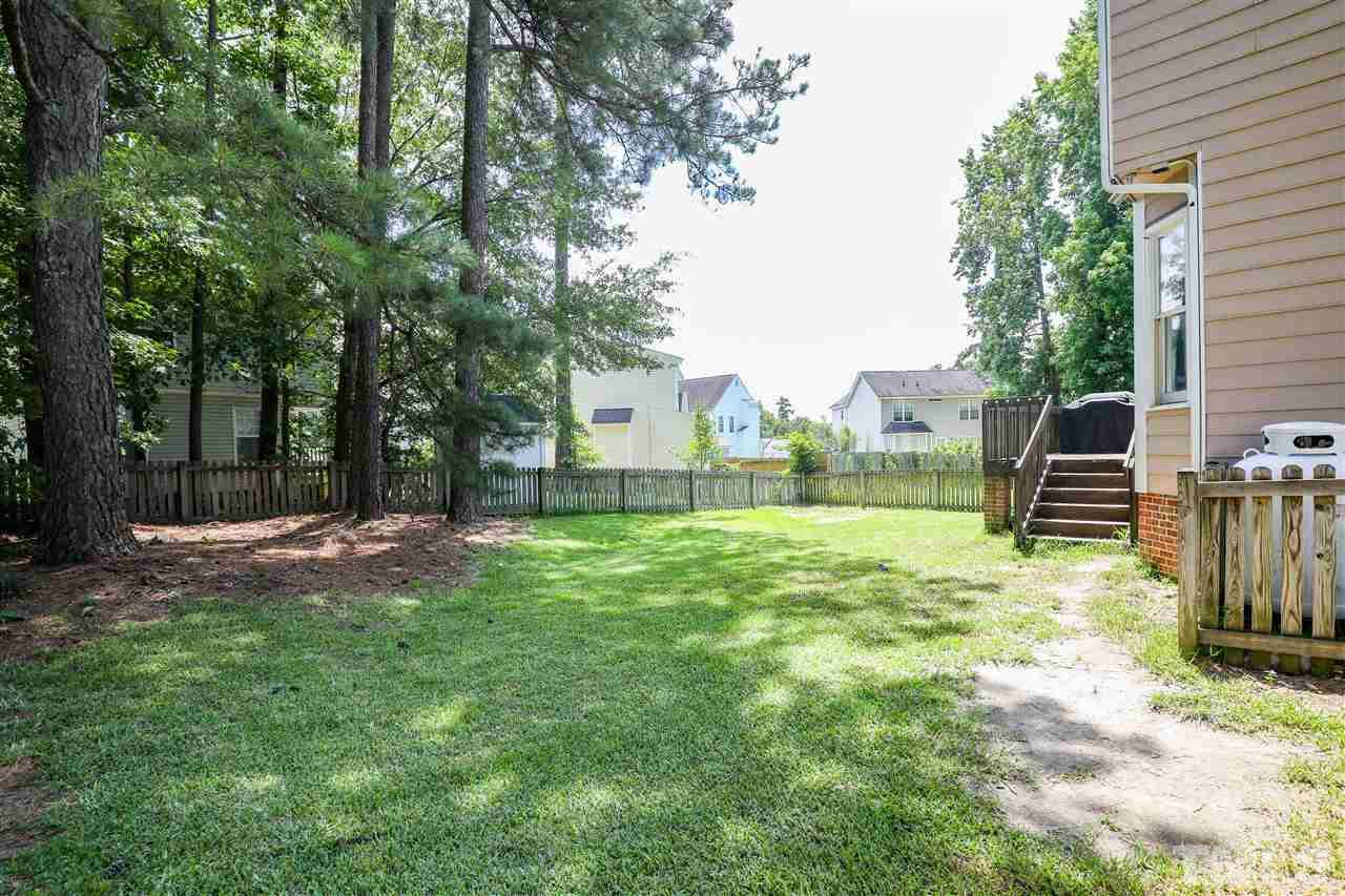 4841 Draper Road Raleigh, NC 27616 - Photo 26 of 30 a view of backyard with seating and green space