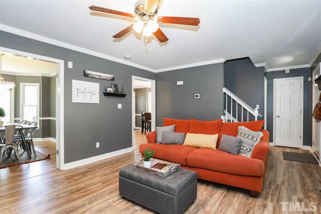 4841 Draper Road Raleigh, NC 27616 - Photo 6 of 30 a living room with furniture and wooden floor