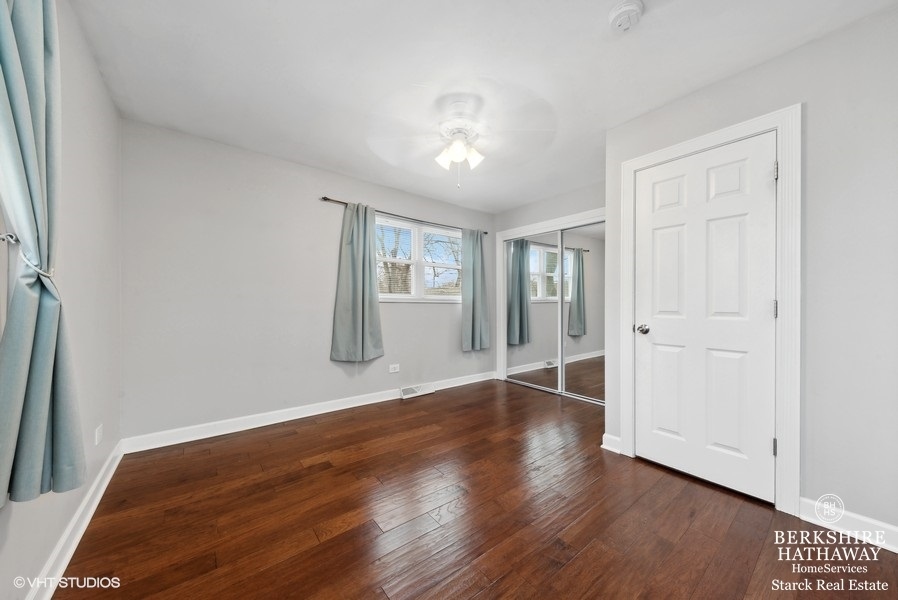 2408 George Street Rolling Meadows, IL 60008 - Photo 11 of 24 an empty room with wooden floor and windows