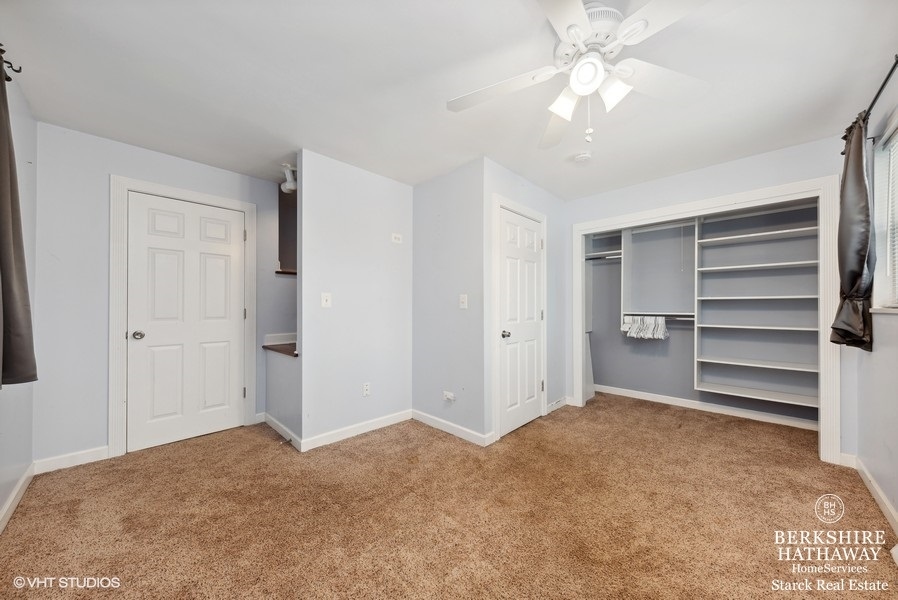 2408 George Street Rolling Meadows, IL 60008 - Photo 10 of 24 a view of an empty room with a ceiling fan