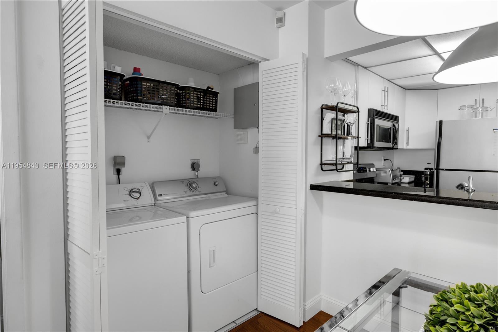 540 Brickell Key Drive, Unit 1514 Miami, FL 33131 - Photo 13 of 22 a utility room with dryer and washer