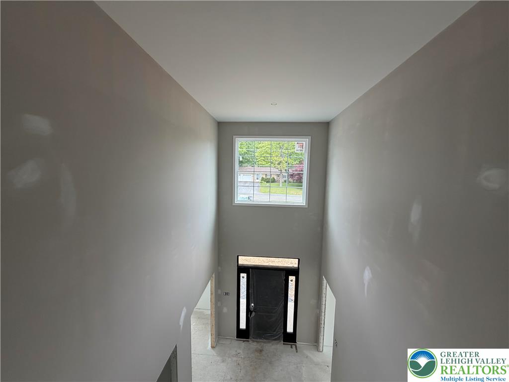1899 Kecks Road Breinigsville, PA 18031 - Photo 18 of 30 This grand entry features soaring ceilings and abundant natural light, creating an inviting atmosphere.