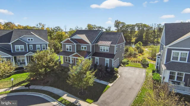 an aerial view of a residential apartment building with a yard