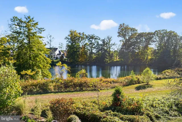 a bedroom with a bed and a table