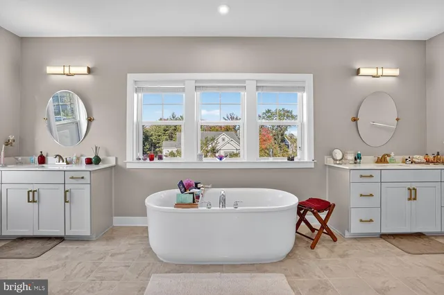 a bedroom with a bed a table and chair