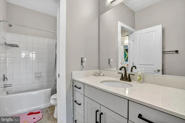 a view of a kitchen with a sink and a large window