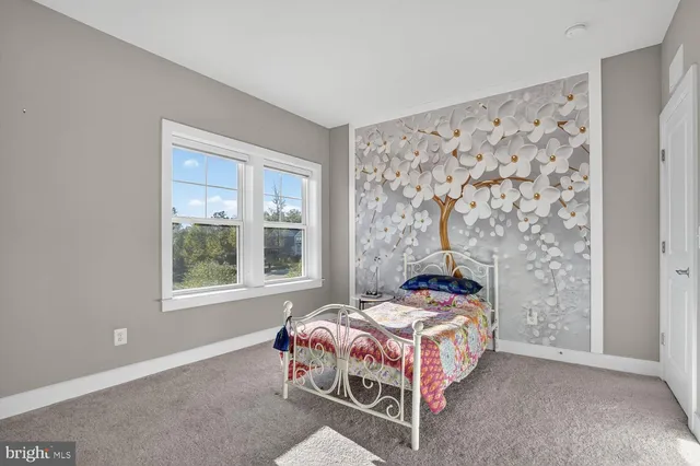 a view of a patio with table and chairs and potted plants