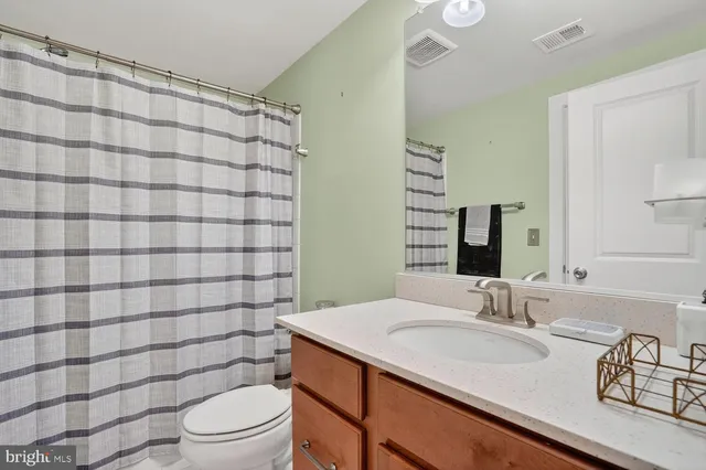 a view of swimming pool with outdoor seating and plants