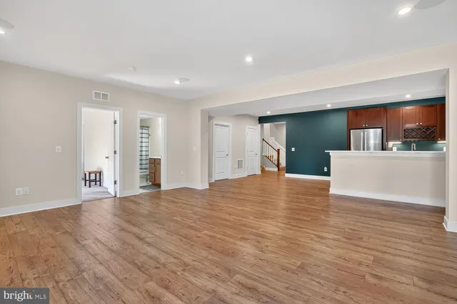 a view of a house with a small yard and a patio