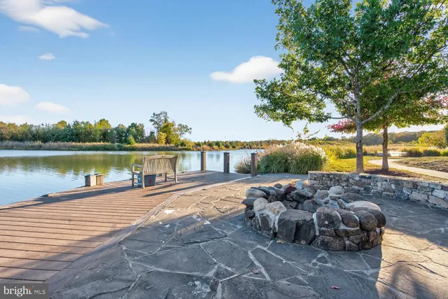 a view of a house with a backyard porch and sitting area