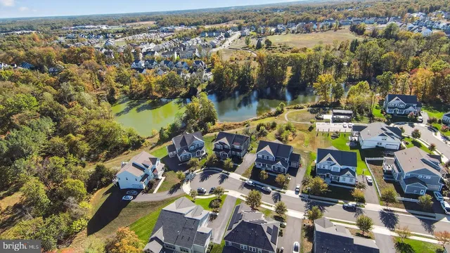 a view of yard with swimming pool and green space