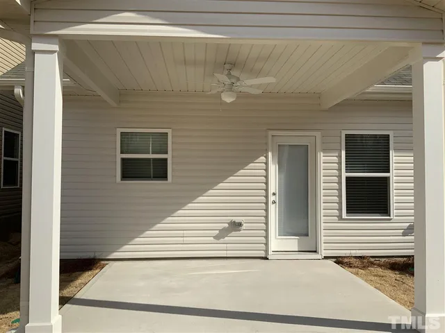 a view of a house with white door and a window