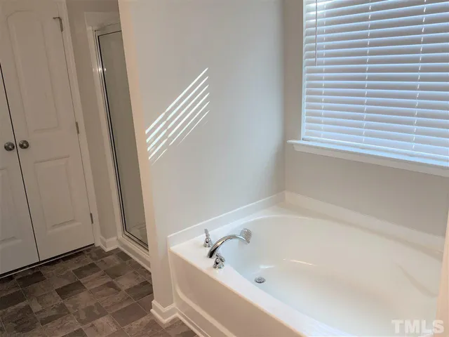 a bathroom with a bathtub