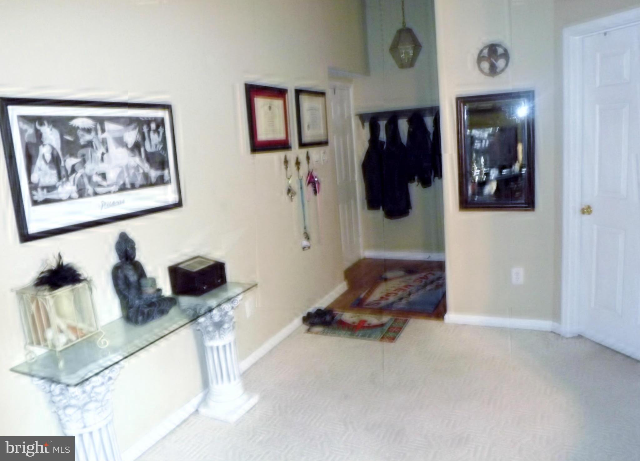 9765 Reese Farm Road, Unit L Owings Mills, MD 21117 - Photo 2 of 17 a living room with furniture and a furniture