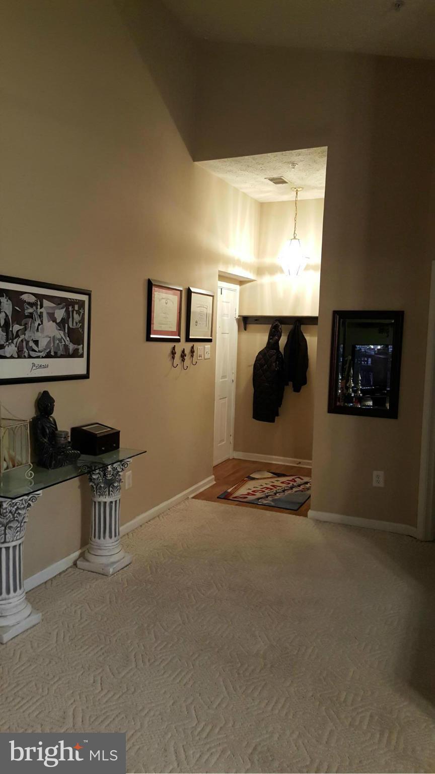 9765 Reese Farm Road, Unit L Owings Mills, MD 21117 - Photo 10 of 17 a view of a livingroom with furniture and window
