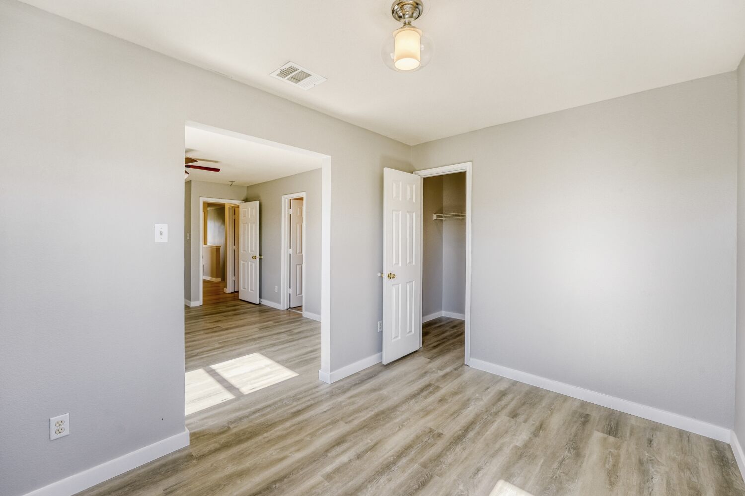 904 Sebastian Bend, Unit B Pflugerville, TX 78660 - Photo 19 of 30 wooden floor in an empty room with a window