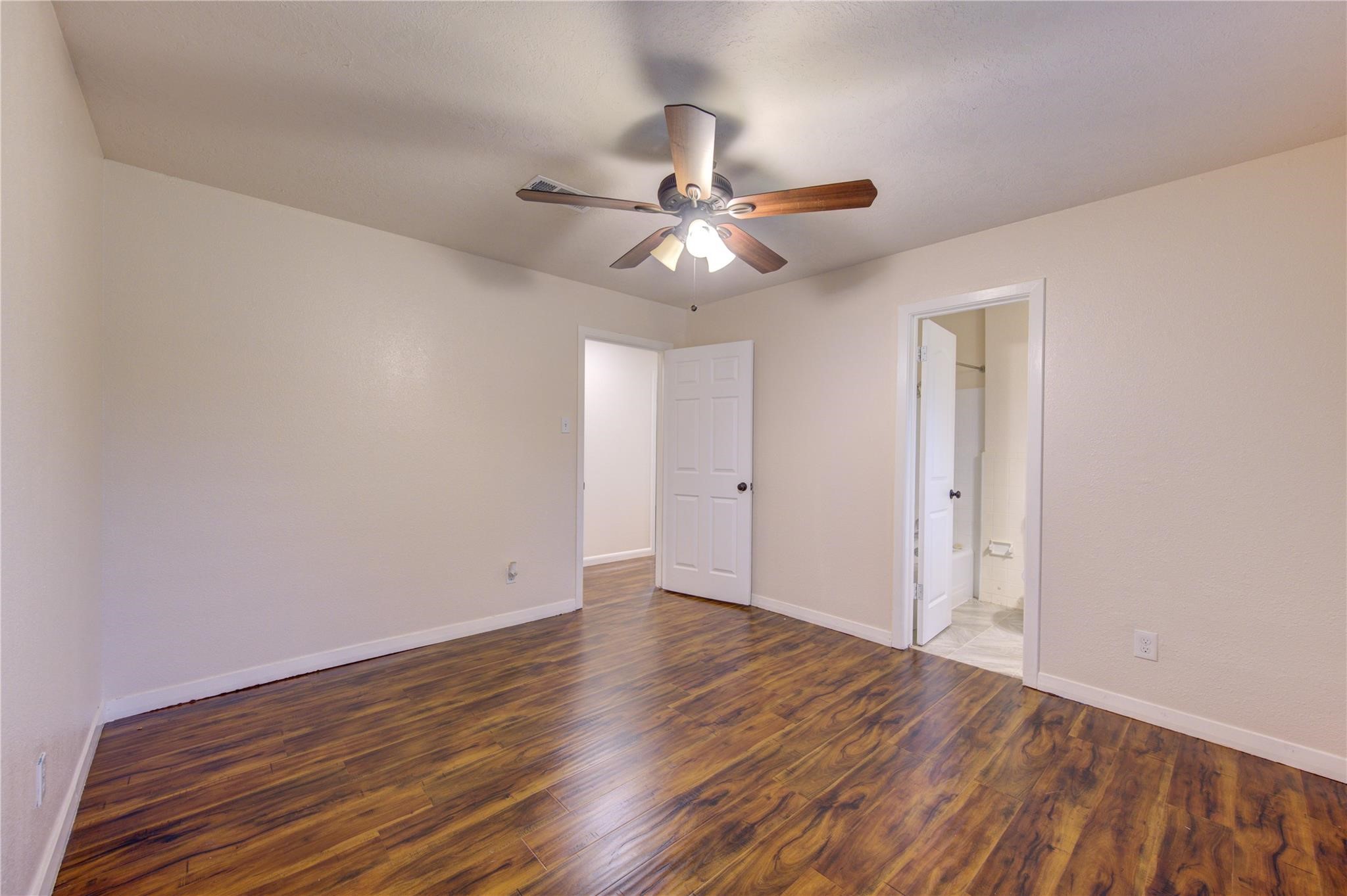 1745 Stone Road Pearland, TX 77581 - Photo 18 of 31 wooden floor in an empty room