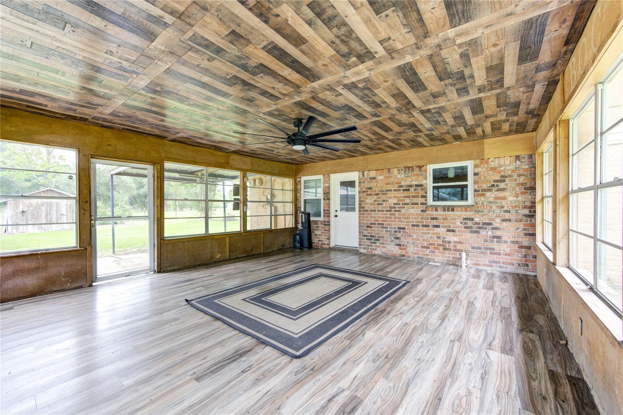 1745 Stone Road Pearland, TX 77581 - Photo 27 of 31 a view of an empty room with wooden floor and a window
