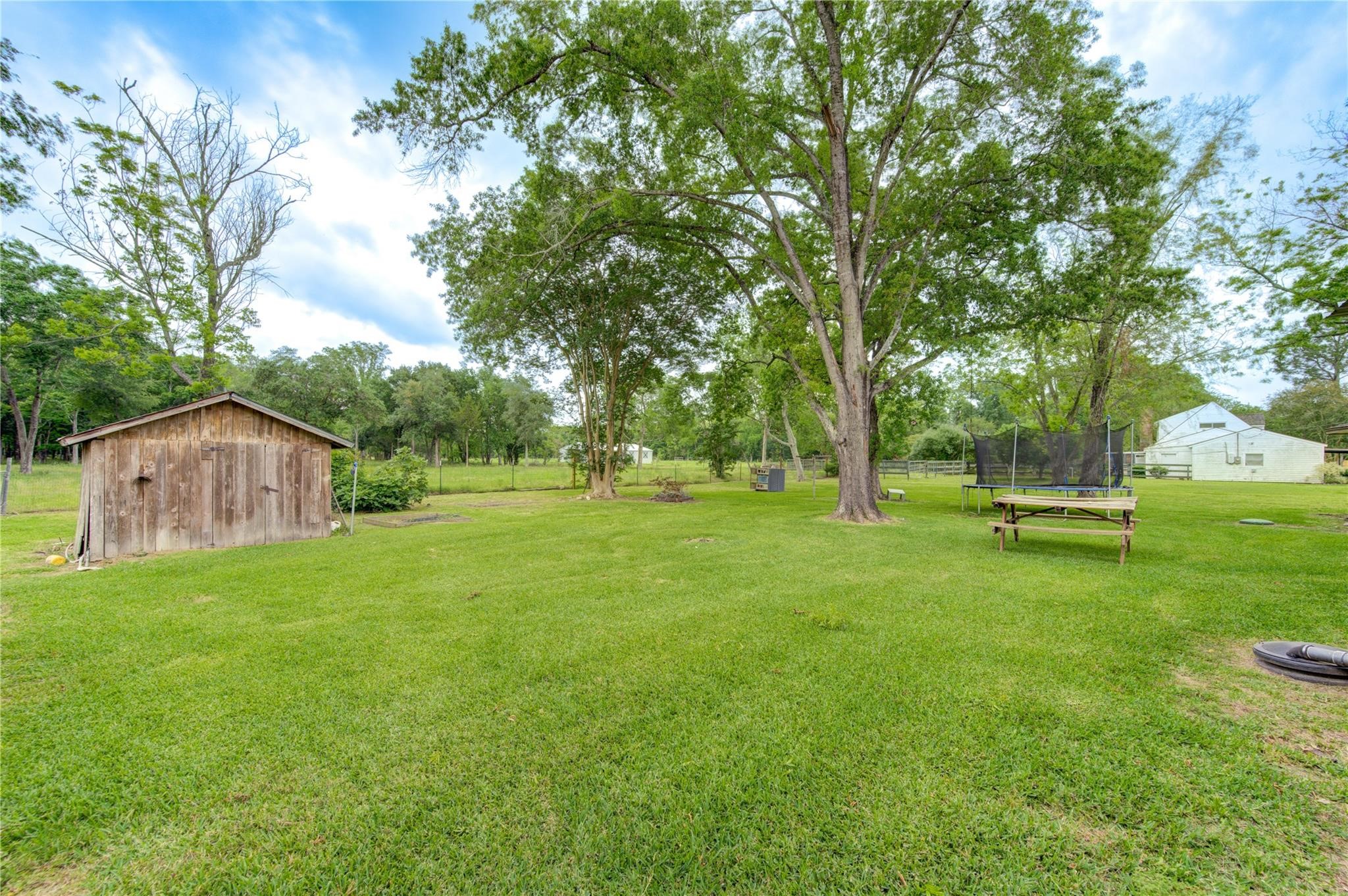1745 Stone Road Pearland, TX 77581 - Photo 29 of 31 a view of a house with a yard
