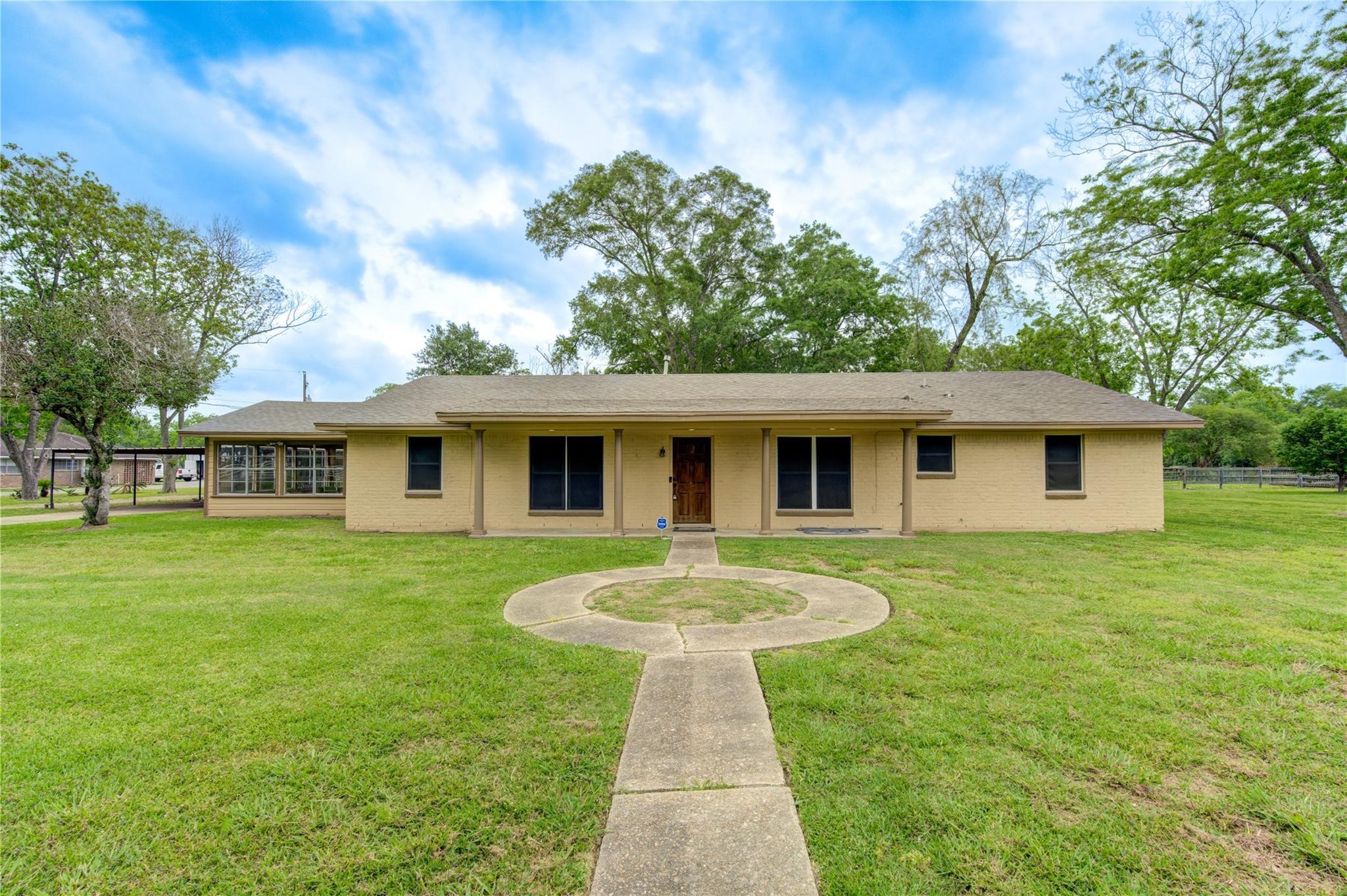 1745 Stone Road Pearland, TX 77581 - Photo 3 of 31 a front view of a house with a garden