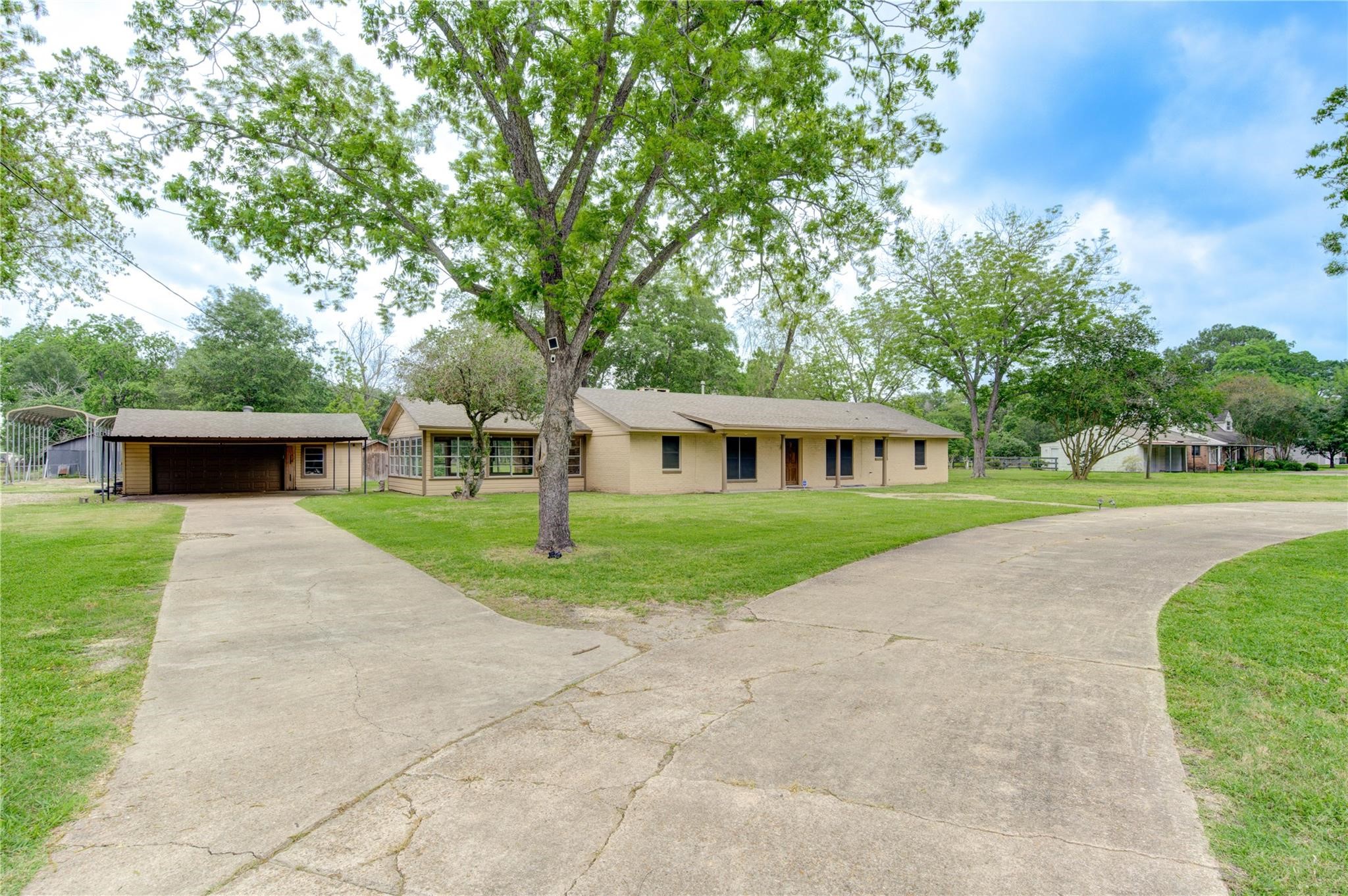 1745 Stone Road Pearland, TX 77581 - Photo 4 of 31 a front view of a house with a yard