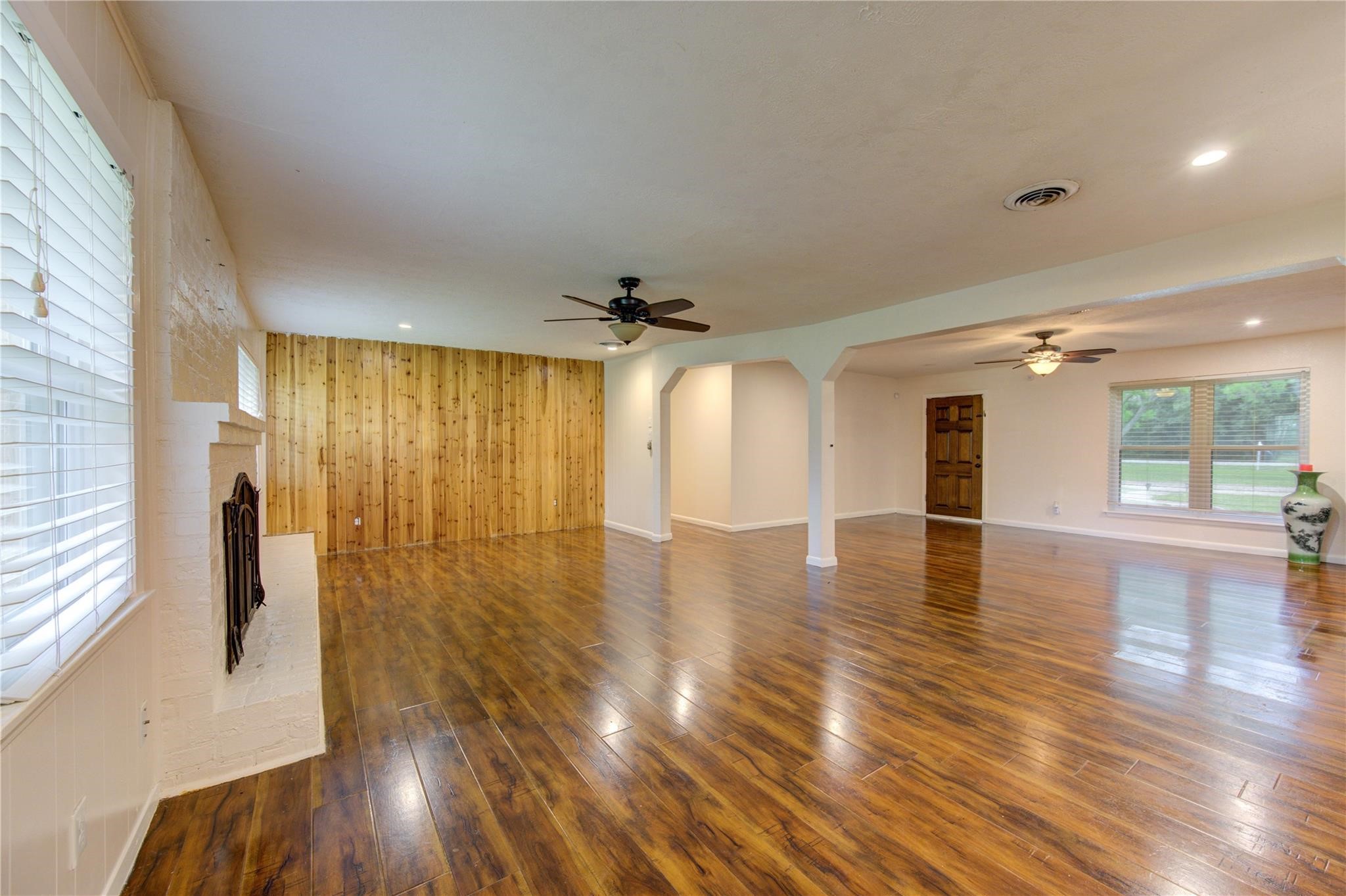1745 Stone Road Pearland, TX 77581 - Photo 8 of 31 a view of a livingroom with wooden floor and a large window