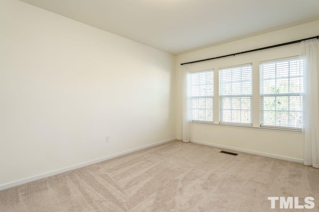 4956 Highcroft Drive Cary, NC 27519 - Photo 11 of 17 an empty room with a window