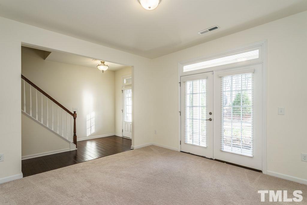 4956 Highcroft Drive Cary, NC 27519 - Photo 2 of 17 a view of an empty room with wooden floor and a window