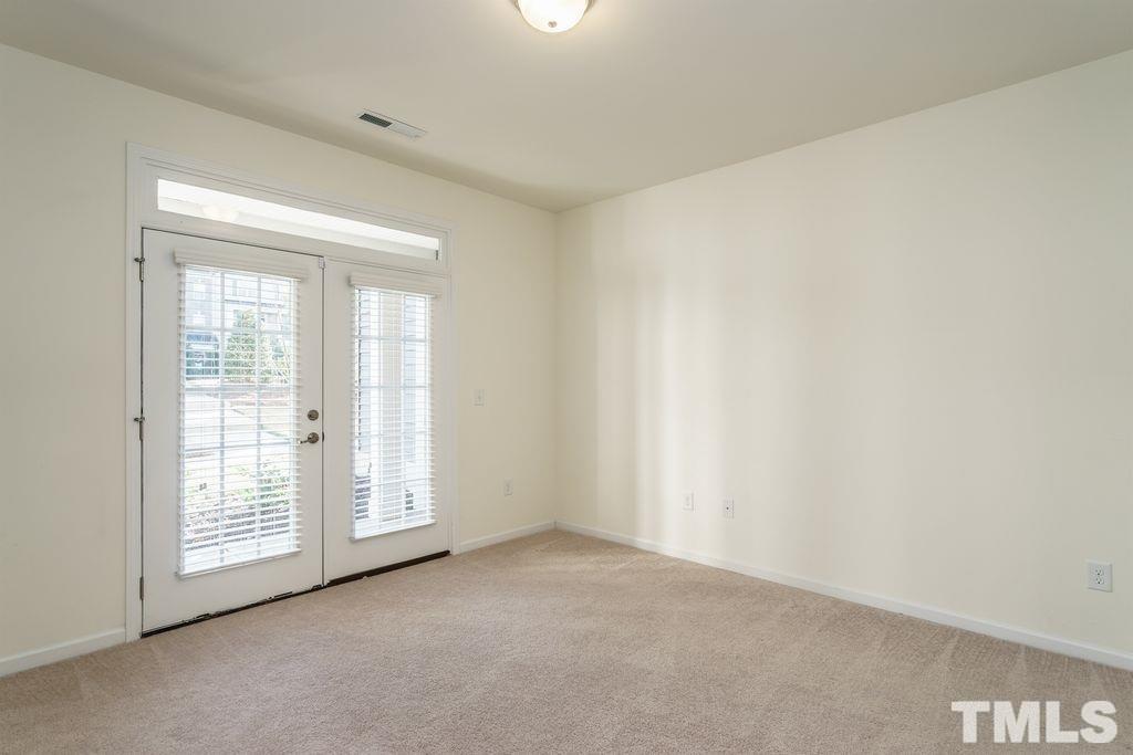 4956 Highcroft Drive Cary, NC 27519 - Photo 3 of 17 an empty room with windows