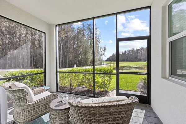 a living room with couch and a large window