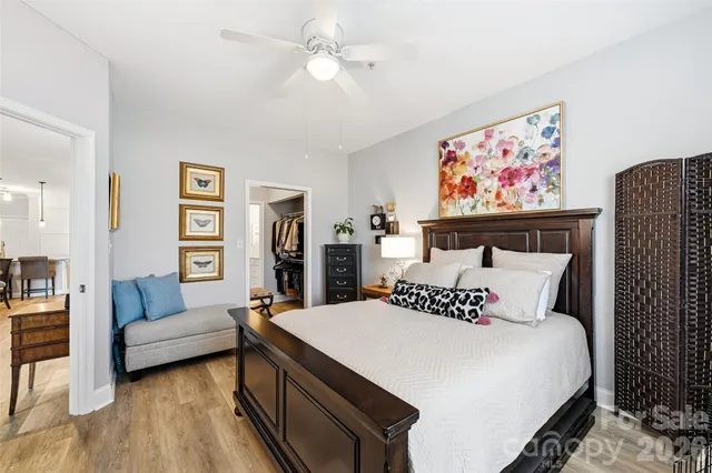 a bedroom with a bed and a couch