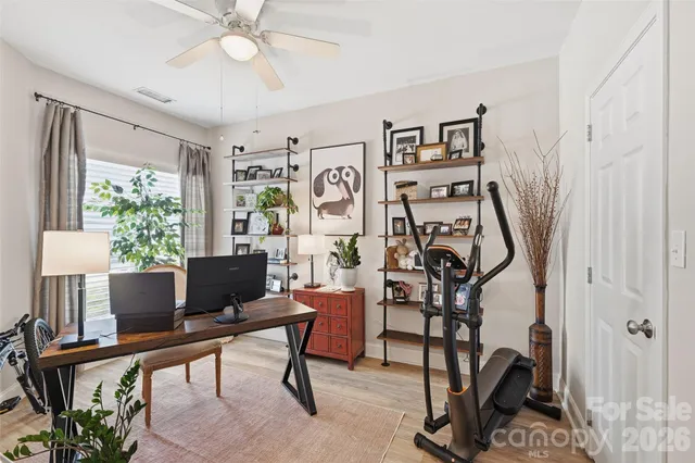 a view of a livingroom with furniture and a window