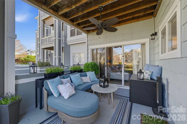a view of an outdoor dining space with a table and chairs