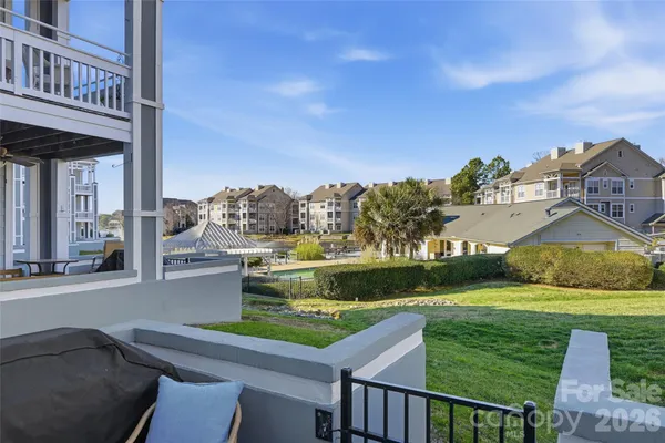 a view of a chairs and table in the patio