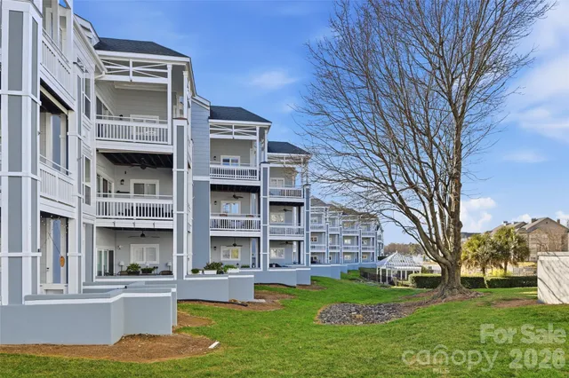 a front view of a building with a garden
