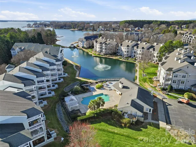an aerial view of a house with a lake view
