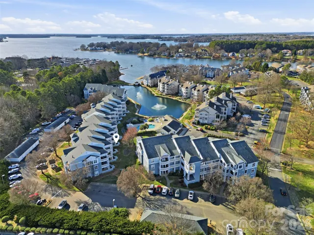 an aerial view of houses with yard