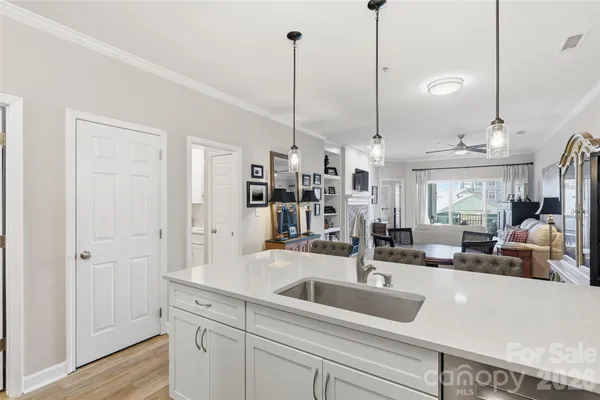 a kitchen with kitchen island a sink and counter space