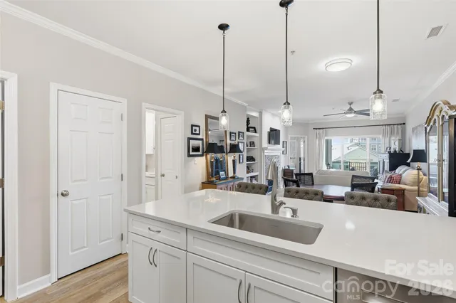 a kitchen with kitchen island a sink and counter space