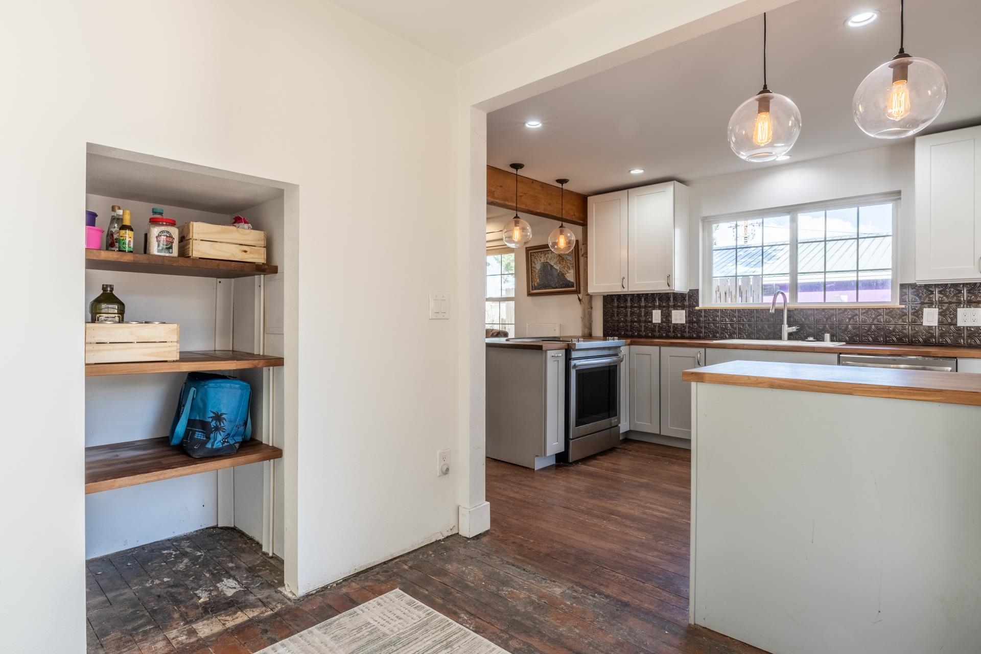 91 3rd Street Lee Vining, CA 93541 - Photo 14 of 44 a kitchen with stainless steel appliances granite countertop a sink a stove and a refrigerator