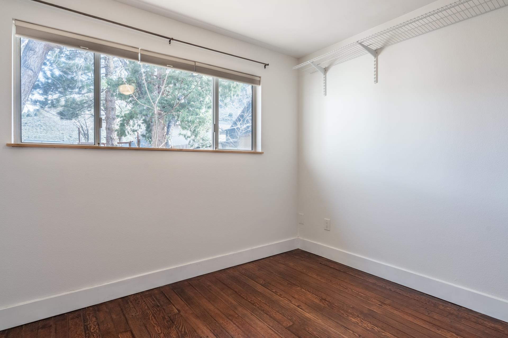 91 3rd Street Lee Vining, CA 93541 - Photo 19 of 44 wooden floor in an empty room with a window